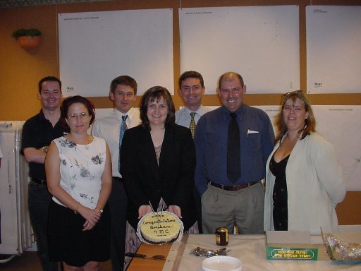 Staff and management with cake