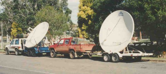 Dave and Jon in their vehicles  with dishes on trailers