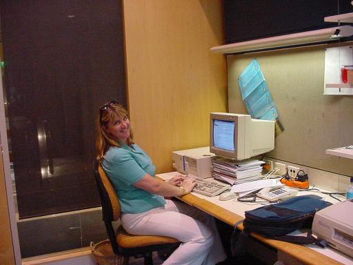 Barbara Adam sitting at her desk