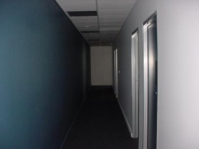 Hall way to the right of the entrance shows radio rooms of the media centre.