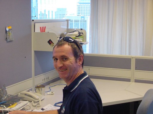 Frank sitting at his desk .