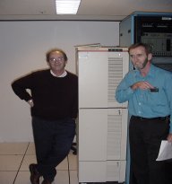 Ken and Kerrod standing next to the AAPIS telephone switch