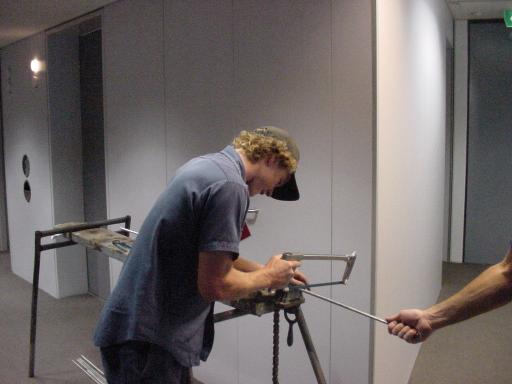 Apprentice cutting hangers to hold pipes